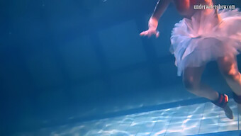 Russian Beauty Bulava Lozhkova In Red Ties And Skirt Under Water