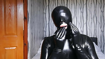 Latex-Clad Bondage Slave In Rubber Suit