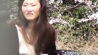 A Seductive Japanese Woman Indulges In Self-Pleasure And Receives A Facial Ejaculation